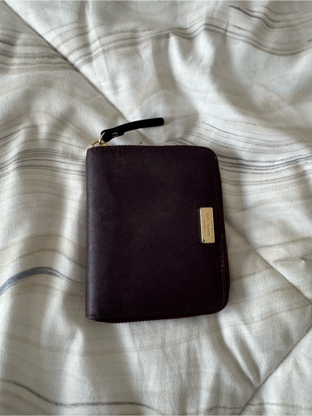 kate spade plum zip-around leather wallet with gold plaque